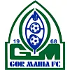 Скамейка запасных футбольной команды после проигранного матча, тренер стоит спиной к полю